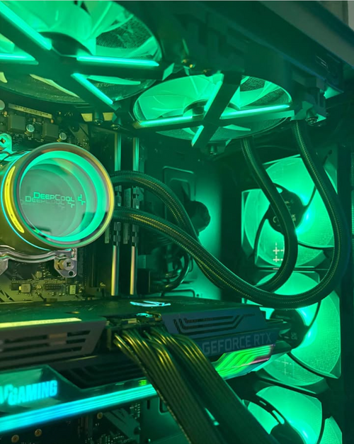Custom gaming PC interior with green RGB lighting